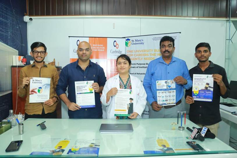 Carebridge team members presenting brochures and press materials at a media event